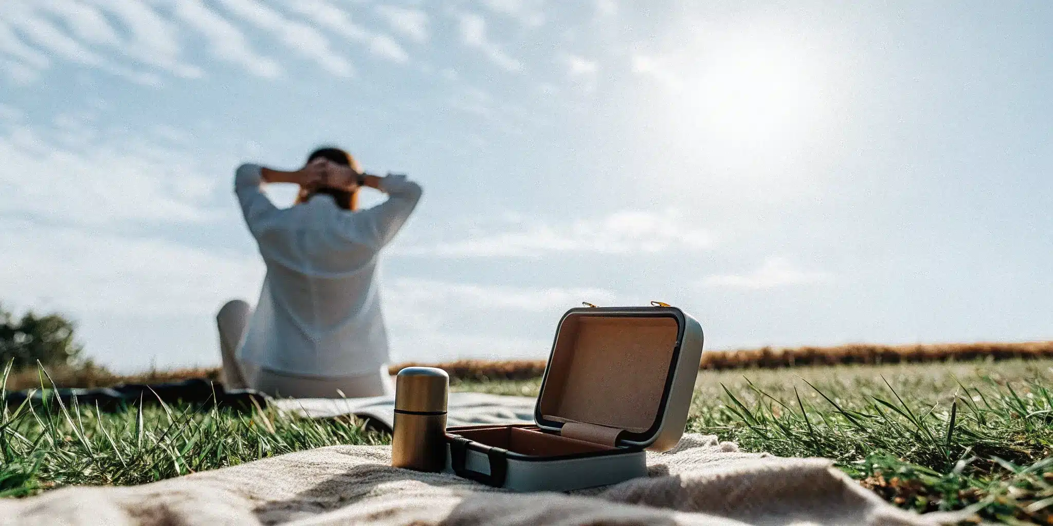 A person relaxing outdoors and enjoying fast-acting muscle pain relief.