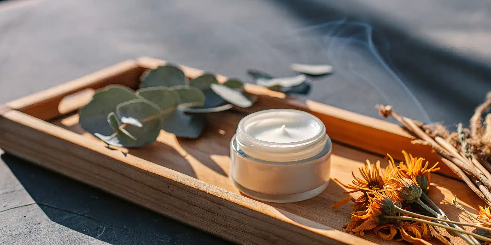 A jar of muscle rub cream with its key natural ingredients.