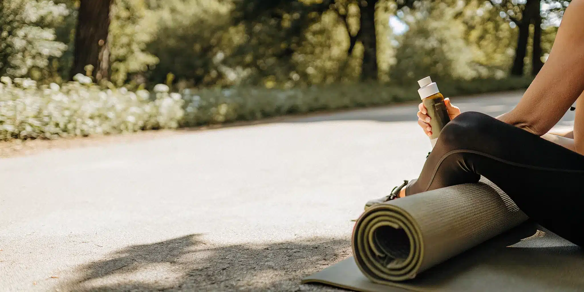Person holding a topical cream for sore muscles after a workout.