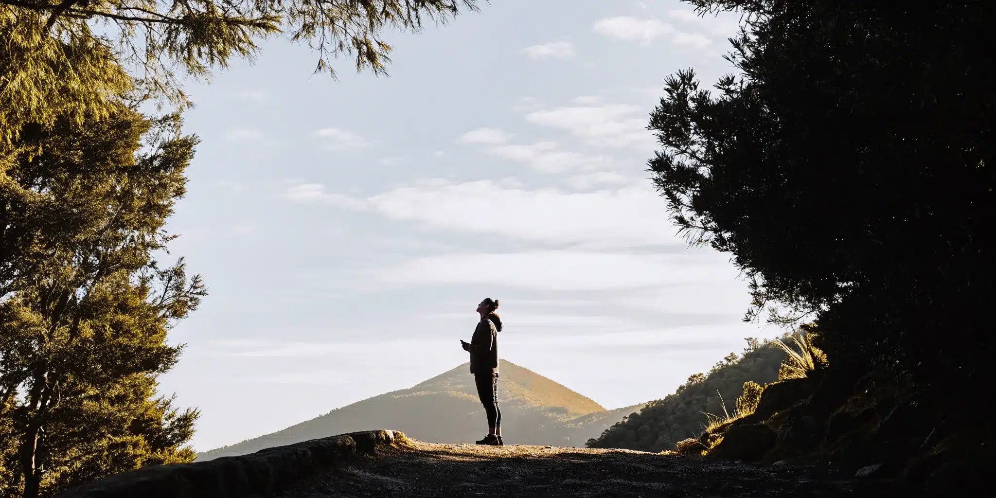 Pain relief for hikers allows an outdoor athlete to enjoy a mountain view.