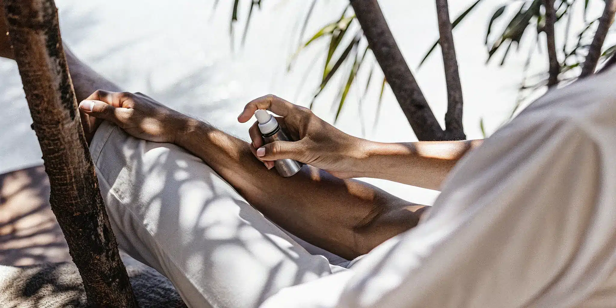 how-menthol–camphor-relieve-muscle-pain-explained-434136 Applying menthol and camphor spray on a leg to relieve muscle pain.