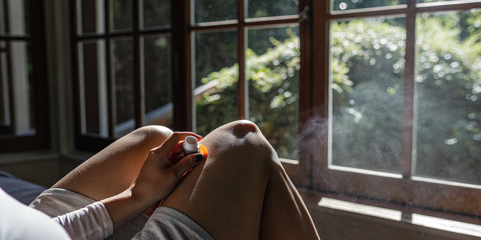 Applying a topical with anti-inflammatory terpenes for knee pain relief.