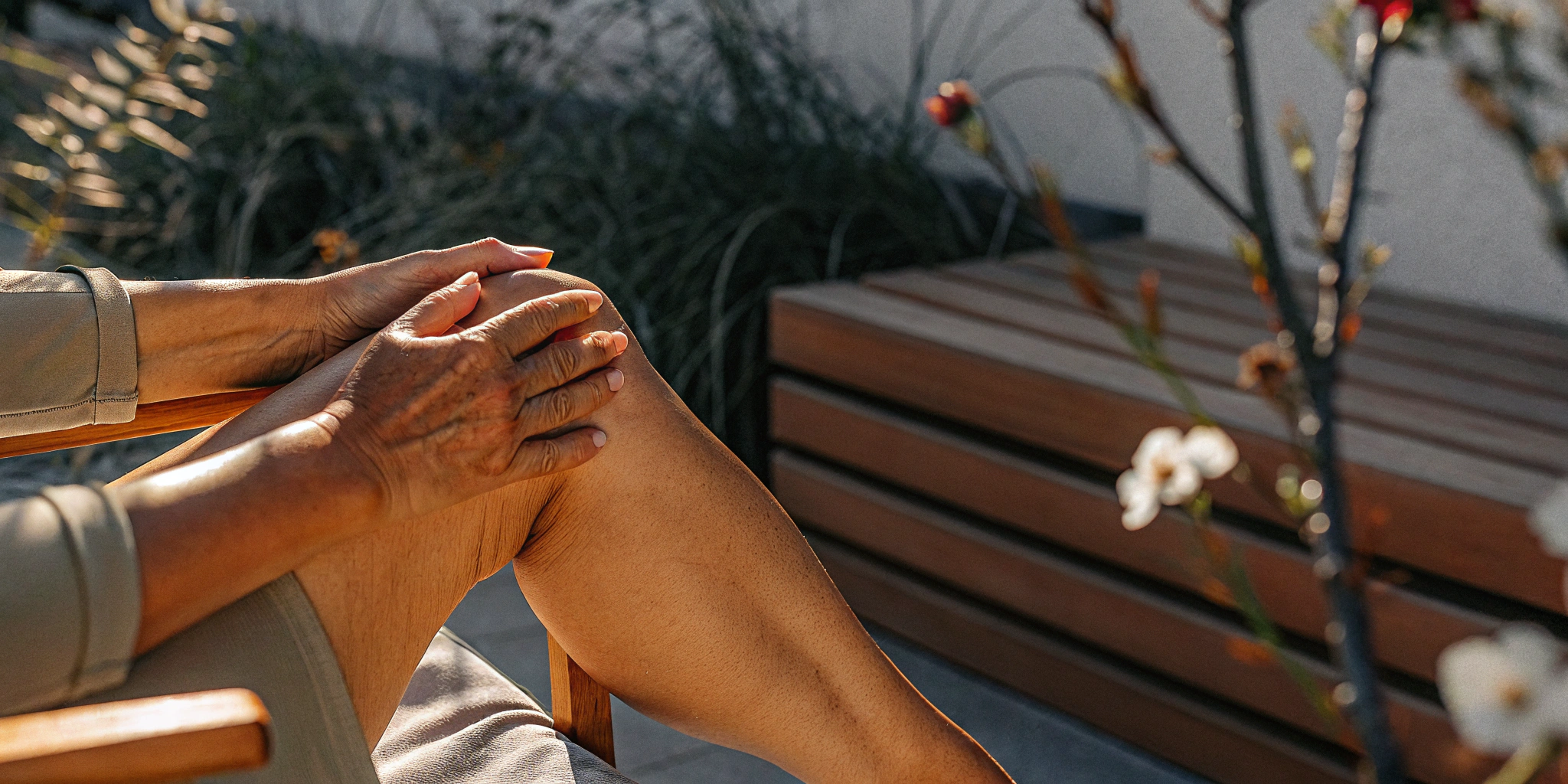 Person holding their knee, finding relief from joint pain with the benefits of camphor.